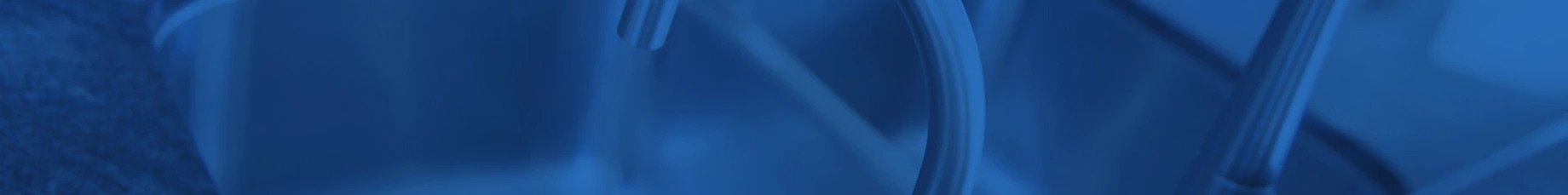 Professional plumber in Penrith fixing a leaking pipe